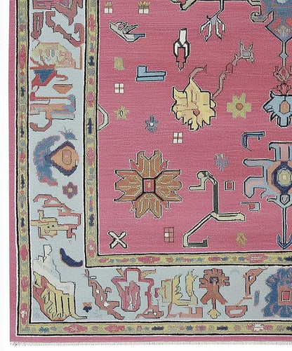 Dusty Rose Oushak Rug with hand-tufted wool floral and geometric patterns in dusty blue and pink tones