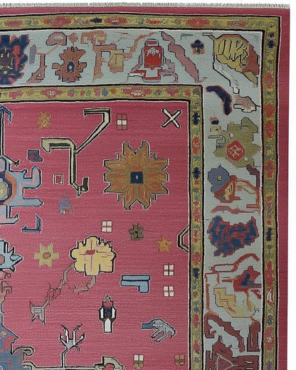 Dusty Rose Oushak Rug with hand-tufted wool floral and geometric pattern in dusty blue and pink tones