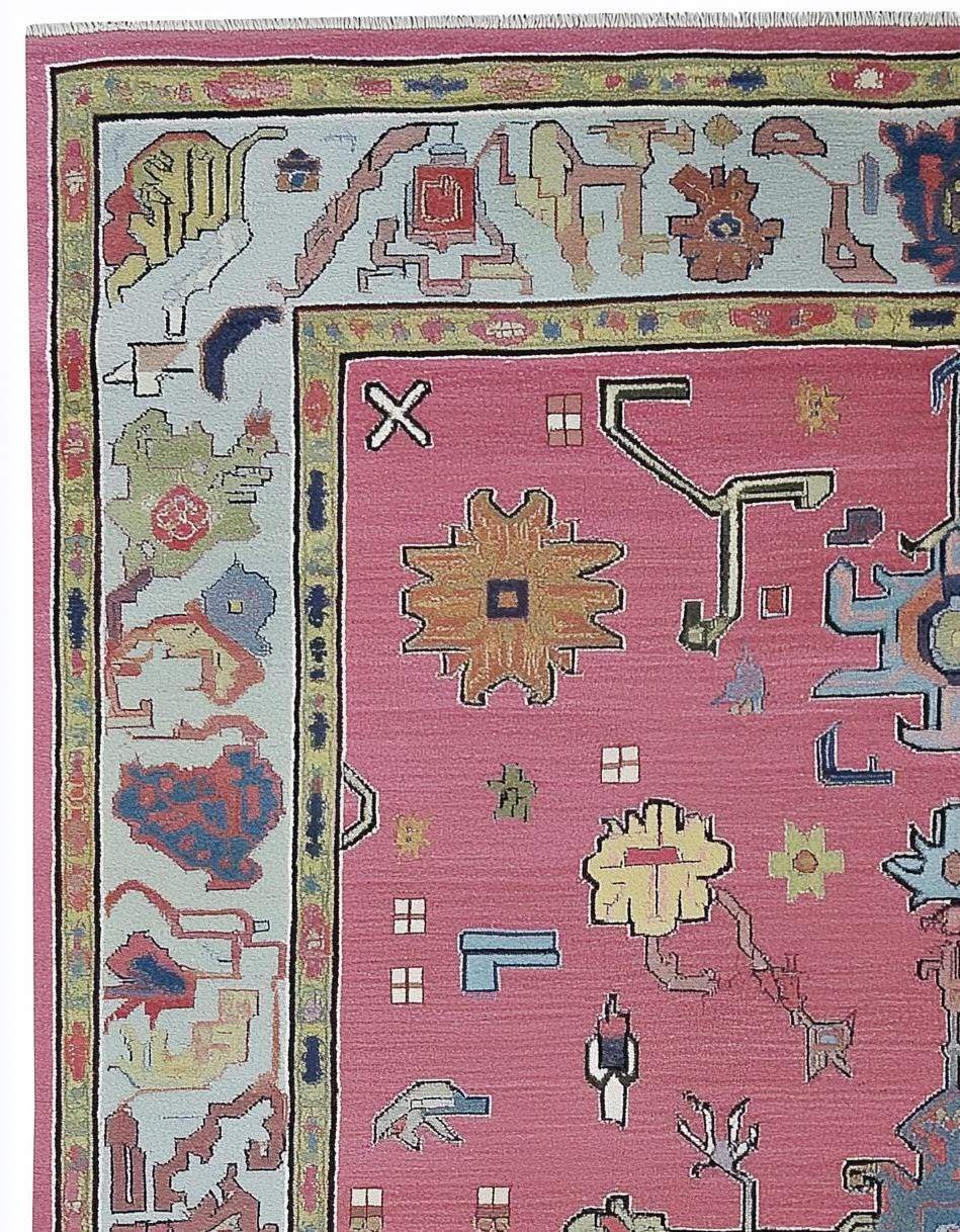 Dusty Rose Oushak Rug in dusty blue and pink with hand-tufted wool floral and geometric design