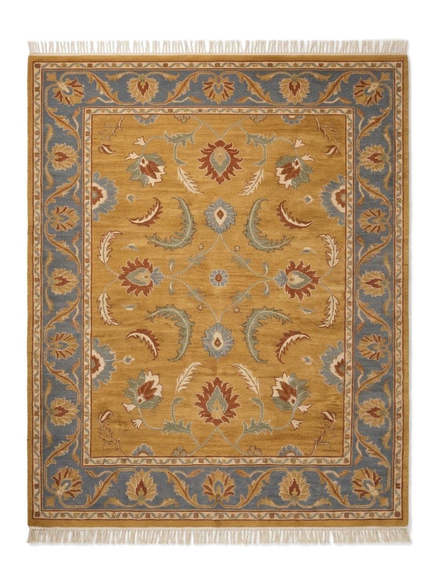Gold Oushak Rug in mustard wool with rust, blue, sage and ivory floral motifs, slate blue border and fringe