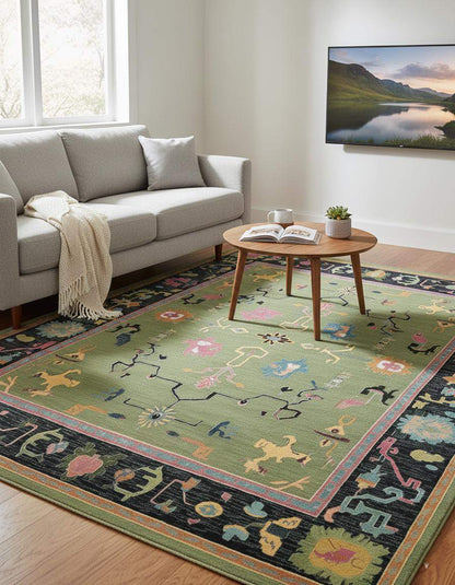 Green abstract knotted area rug with geometric multicolor motifs and retro boho style in rectangular shape