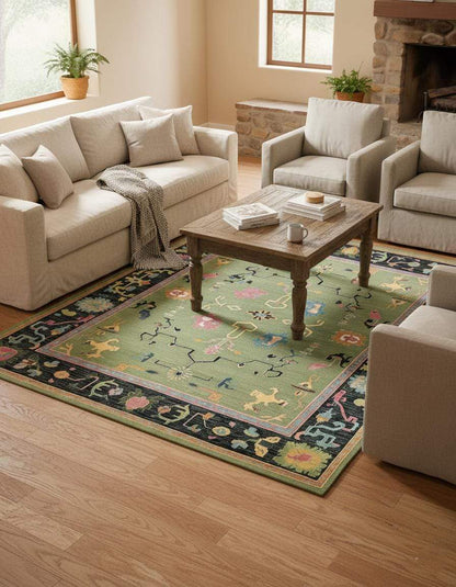 Green abstract knotted area rug with geometric and multicolor motifs in a rectangular retro boho style
