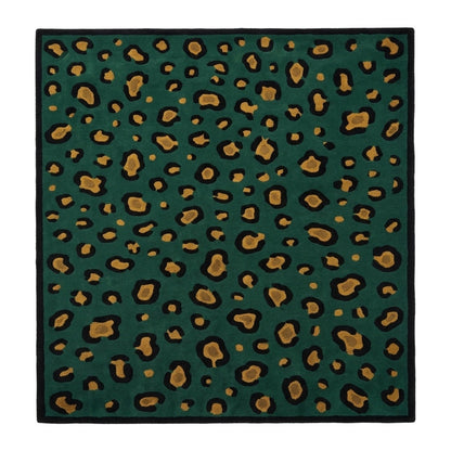 Green Leopard Rug with a deep emerald wool surface, black and ochre animal spots, and a solid black border