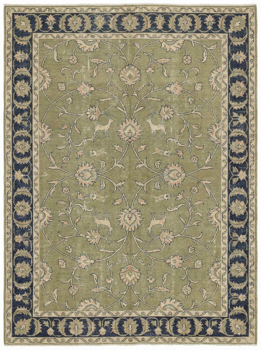 Green Oushak floral animal pattern hand-knotted wool area rug with sage green field and navy border