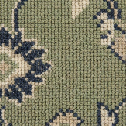 Green Oushak floral animal pattern hand-knotted wool area rug with sage field and navy border
