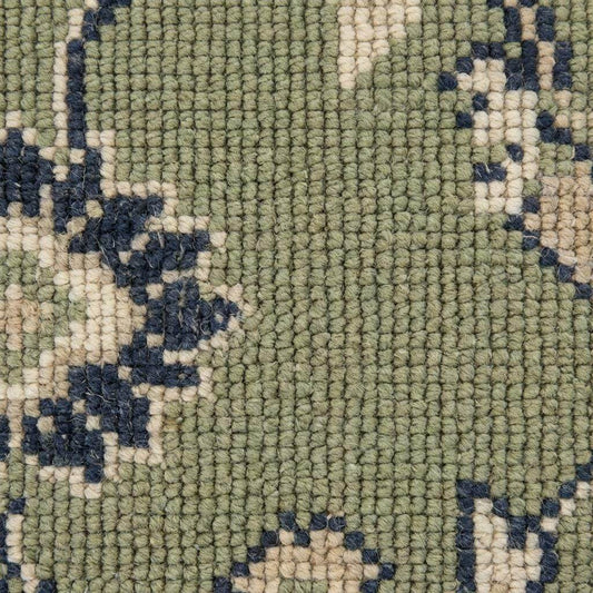 Green Oushak floral animal pattern hand-knotted wool area rug with sage field and navy border