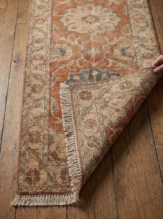 Hand knotted Oushak runner rug with rust floral medallion design in vintage Turkish style for hallway decor