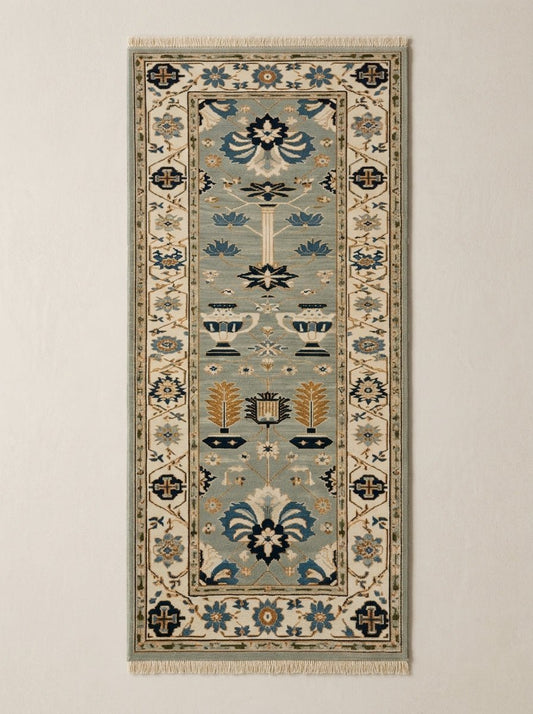 Hand Knotted Oushak Runner Rug in soft blue wool, with ivory floral borders, navy and copper garden motifs, and fringe.