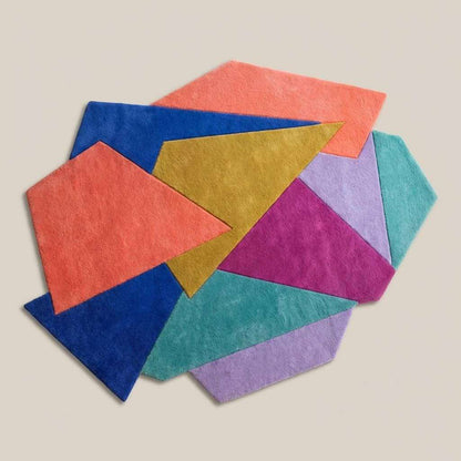 Hand tufted abstract geometric rug with modern color block design and plush pile texture