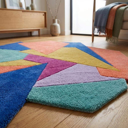 Hand tufted abstract geometric rug with modern color block design and irregular shape