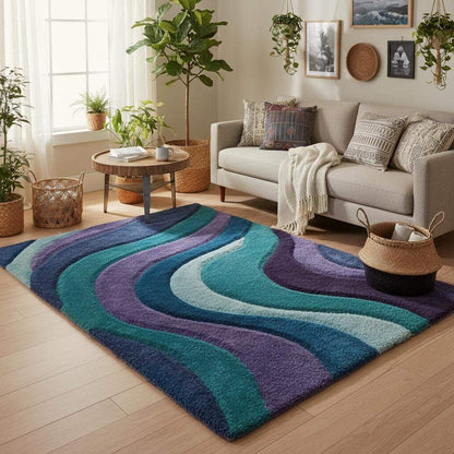 Hand tufted area rug with retro abstract wave design in teal, blue, purple, and mint tones, plush high-pile finish