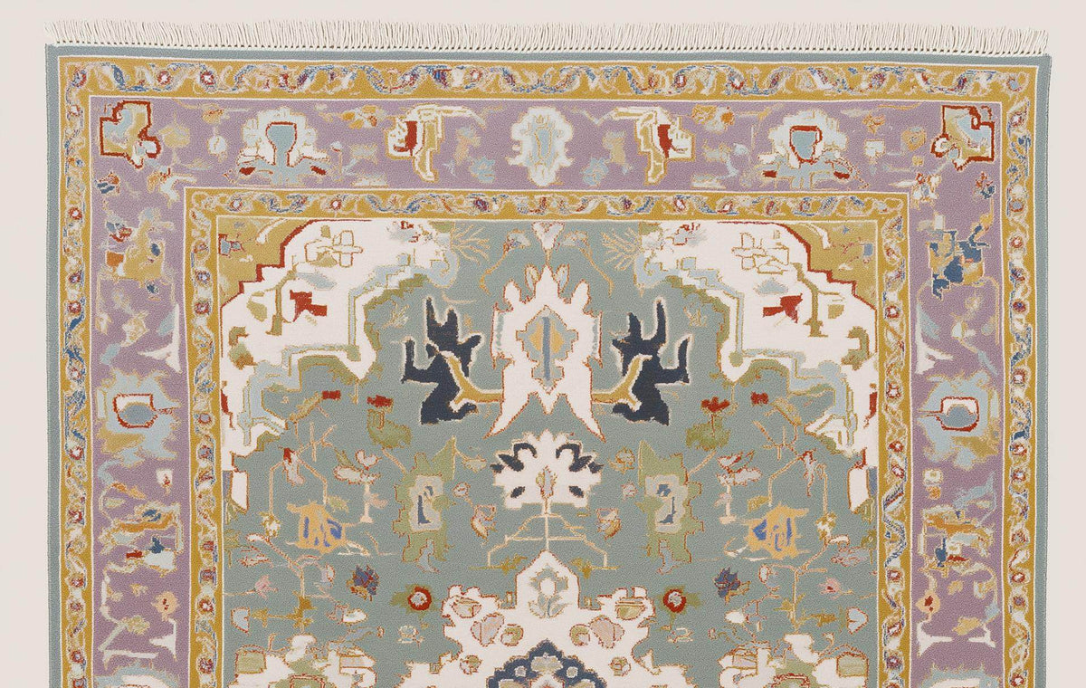 Hand-tufted wool area rug with vintage pastel medallion and boho Persian design