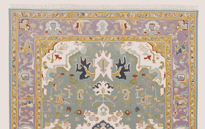 Hand-tufted wool area rug with vintage pastel medallion and boho Persian design
