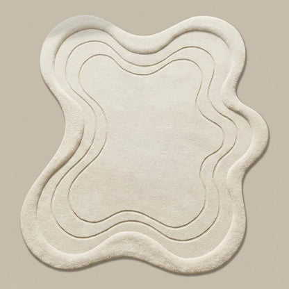 Modern sculpted ivory area rug with layered abstract lines styled beside curved accent chair on light wood floor. __etsy:7756229545