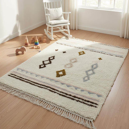 Hand-woven wool rug with pastel Moroccan diamond pattern in blush pink and powder blue on creamy background for boho home decor