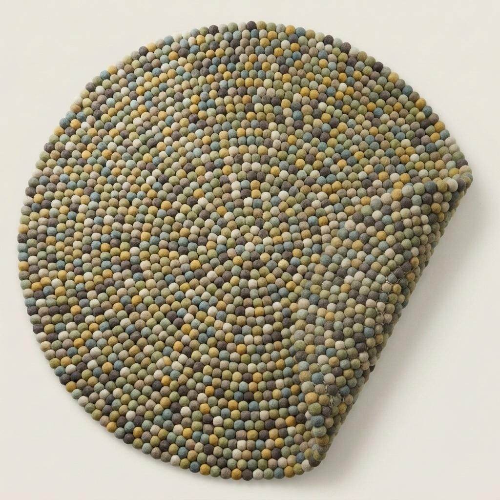 Handmade wool felt ball rug in sage green with multicolor earthy tones, round boho nursery carpet