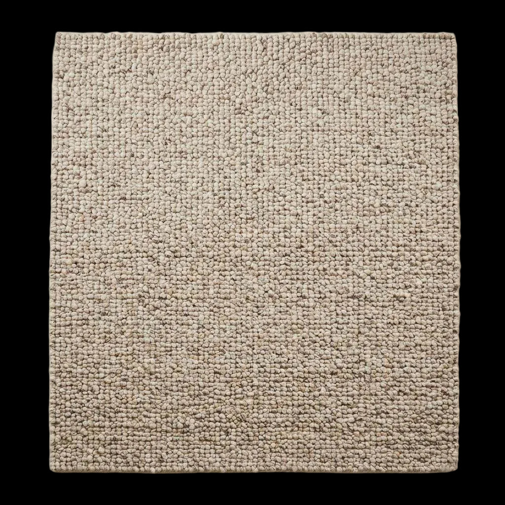 Handwoven chunky wool rug with natural beige pebble texture in Scandinavian living room setting