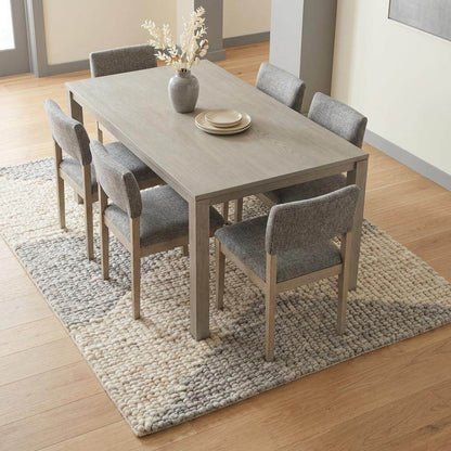 Handwoven chunky wool rug in neutral cream, beige, and gray tones with subtle geometric pattern for Scandinavian and minimalist interiors