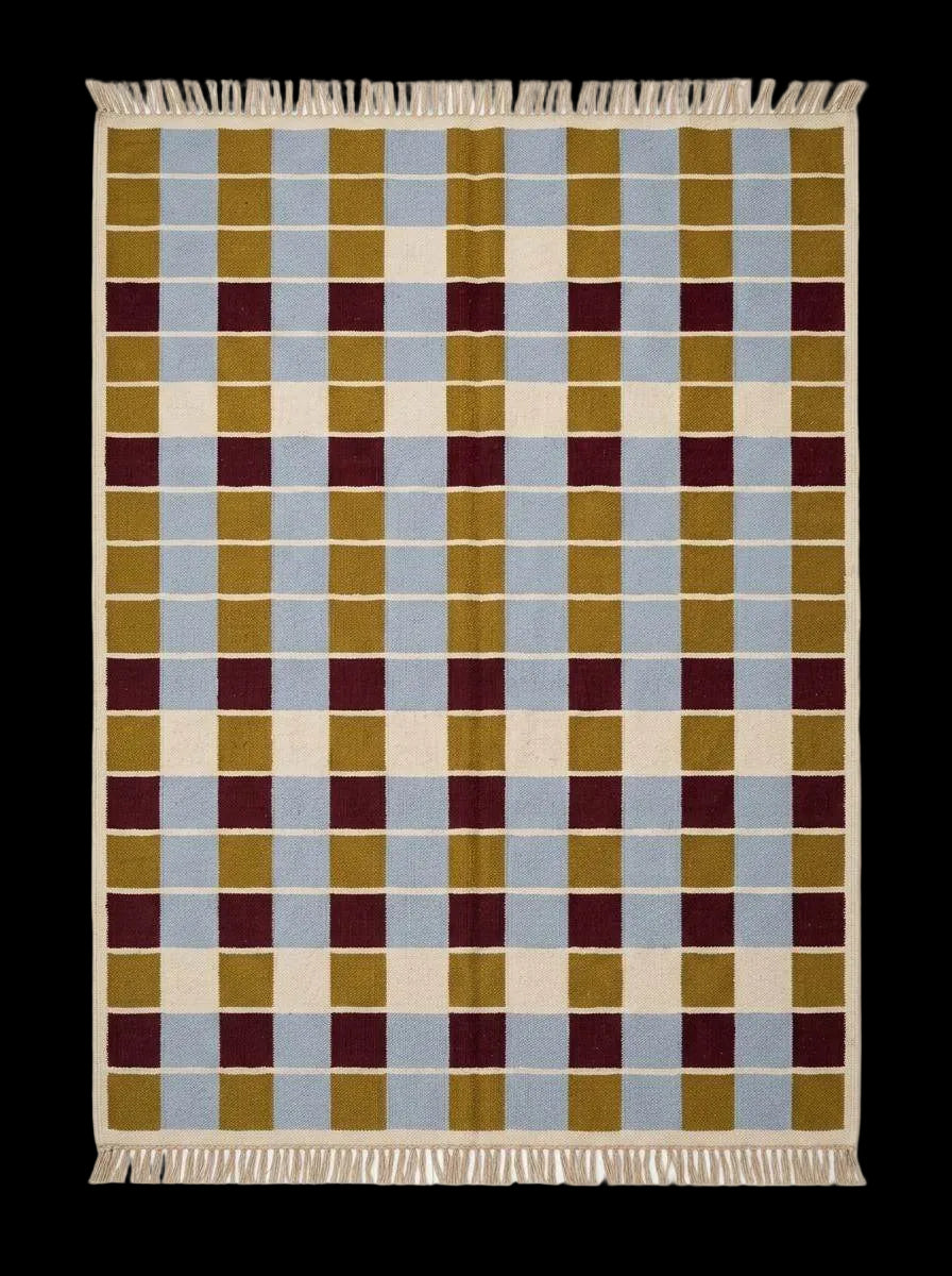 Handwoven flatweave checkered rug in mustard, dusty blue, burgundy, and ivory wool with a modern geometric design for living room decor