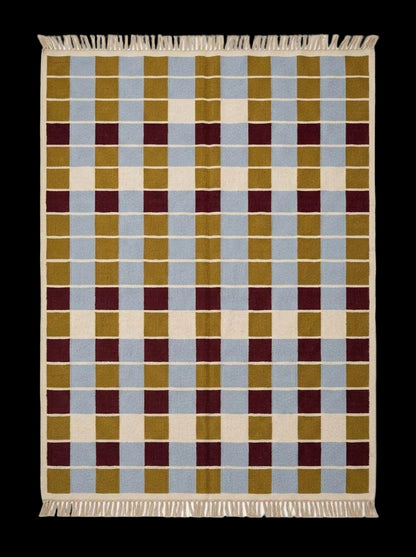 Handwoven flatweave checkered rug in mustard, dusty blue, burgundy, and ivory wool with a modern geometric design for living room decor