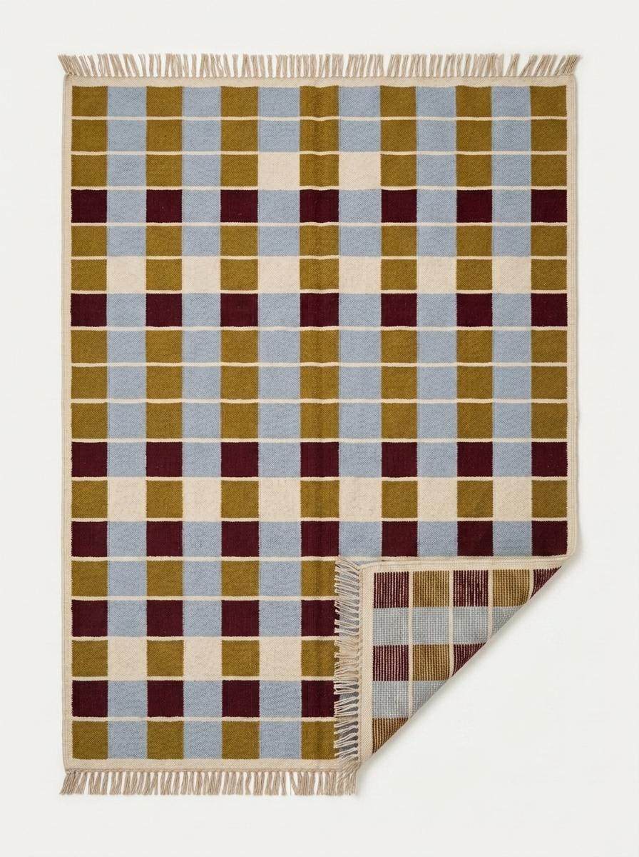 Handwoven flatweave checkered rug in mustard, dusty blue, burgundy, and ivory geometric design for living room decor