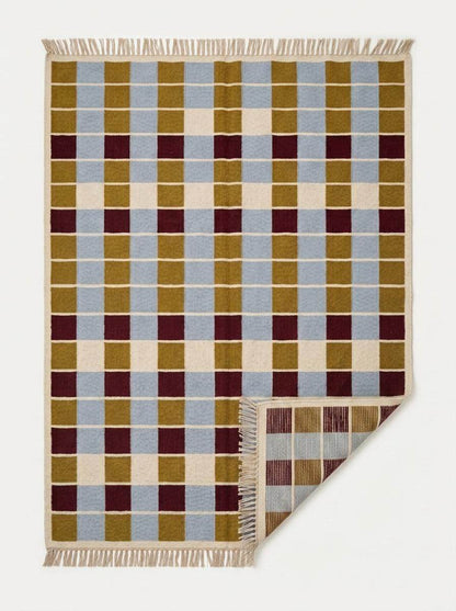 Handwoven flatweave checkered rug in mustard, dusty blue, burgundy, and ivory geometric design for living room decor