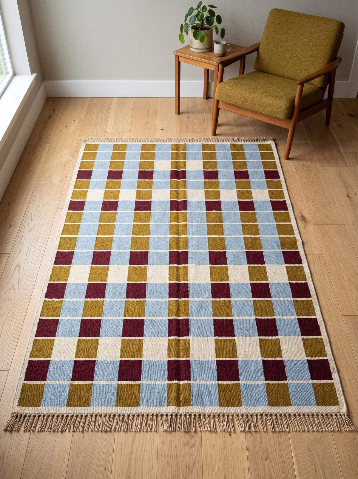 Handwoven flatweave checkered rug in mustard, dusty blue, burgundy, and ivory geometric grid pattern