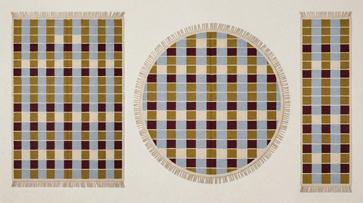 Handwoven flatweave checkered rug in mustard, dusty blue, burgundy, and ivory geometric pattern for modern living room decor
