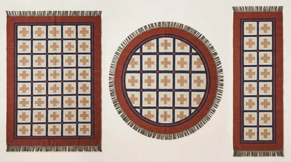 Handwoven flatweave wool rug with Southwestern rust and navy geometric cross pattern for living room