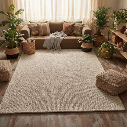 Handwoven Neutral Wool area rug in a loop-textured natural wool fiber with a soft, neutral beige color and cozy organic feel.