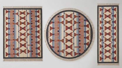 Handwoven wool flatweave rug with geometric kilim pattern in ivory, terracotta, blue, and gray colors for living room decor