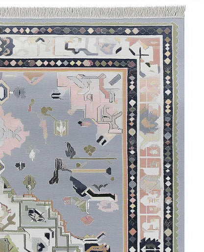 Soft gray Oushak rug with pastel geometric medallion and stylized motifs, hand-tufted wool blend