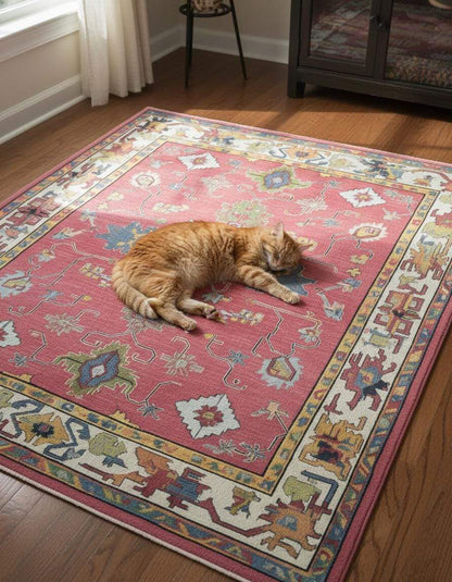 Red abstract floral knotted area rug with colorful geometric motifs and detailed border in boho Turkish style