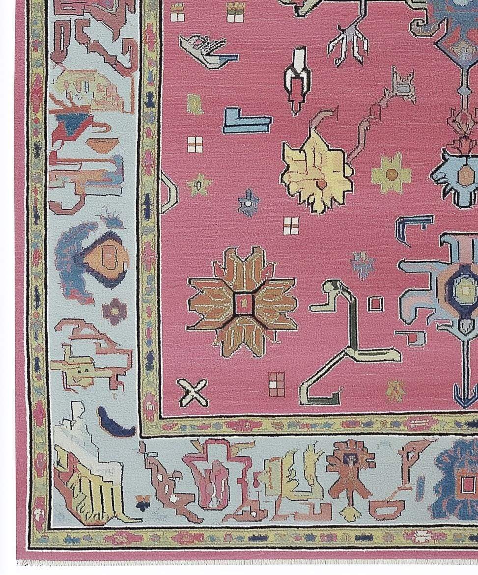 Dusty Rose Oushak Rug with hand-tufted wool floral and geometric patterns in dusty blue and pink tones