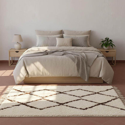 Handmade Moroccan shag rug with ivory background and dark brown diamond pattern, plush high-pile texture for boho minimalist decor