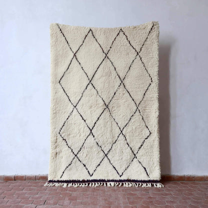 Oversized Beni Ourain wool rug with ivory base and black diamond pattern, hand-knotted Moroccan design