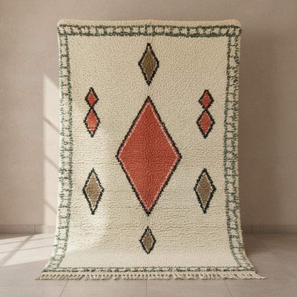 Handmade wool area rug with geometric diamond pattern in cream, brick red, tan, and muted green boho Moroccan style