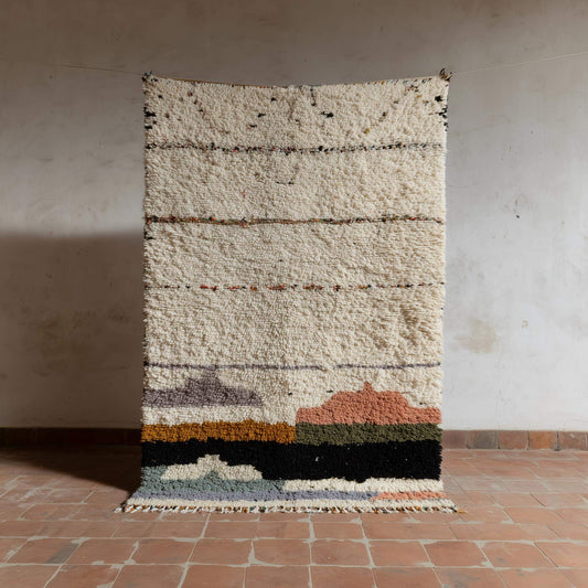 Handwoven Moroccan Boucherouite rug in cream and pastel colors with plush wool texture for boho home decor