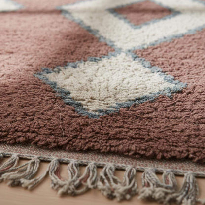 Vintage hand-woven Moroccan rug with brown base, cream diamond Berber pattern, and subtle blue edging