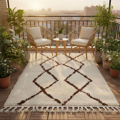 Handmade Moroccan shag rug with ivory background and dark brown diamond pattern, plush high-pile boho accent rug