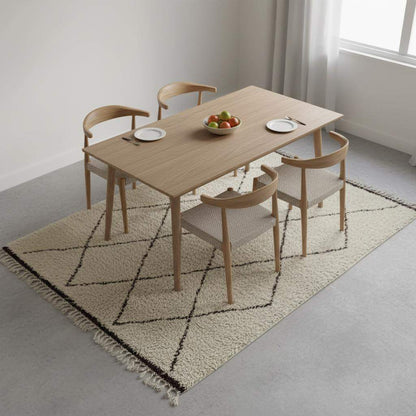 Oversized Beni Ourain wool rug with ivory base and black diamond pattern, hand-knotted Moroccan design