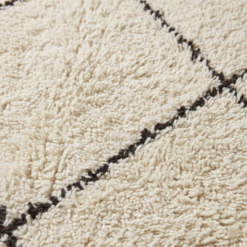 Oversized Beni Ourain wool rug with ivory base and black diamond pattern hand-knotted Moroccan design