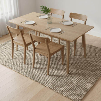 Handmade textured wool mat in natural beige pebble design with chunky knitted loops for modern home decor