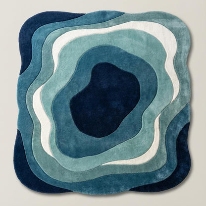 Artistic blue carpet with topographic-inspired layers, placed in a mid-century modern room with wooden furniture and greenery