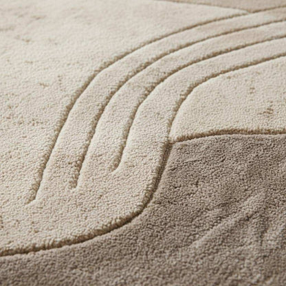 Neutral sculpted wool rug with textured surface, round shape for living room decor