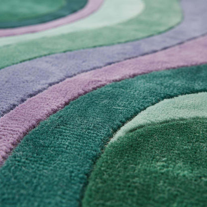Modern wavy area rug with retro green and purple abstract pattern, plush durable carpet for living rooms and bedrooms