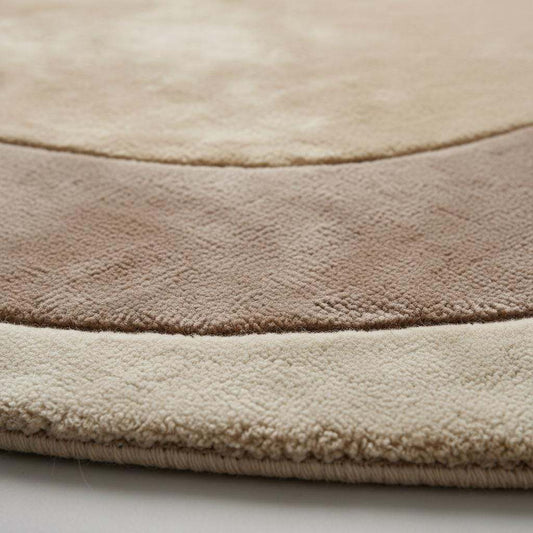Close-up detail of a handmade tufted rug showing textured wool and stitching