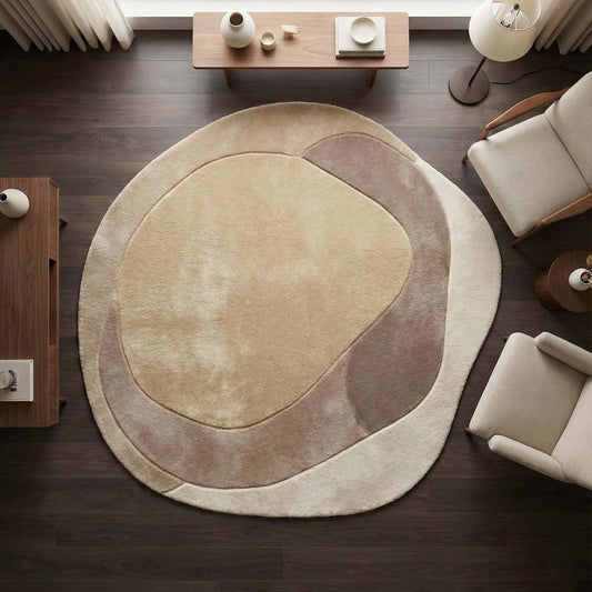 Modern abstract rug with organic shape, plush beige microfiber, anti-slip backing, and sculpted taupe pattern.