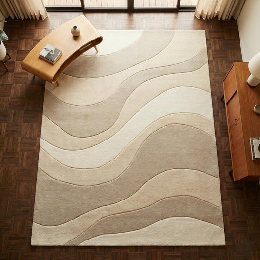 Beige cream area rug with wavy pattern for minimalist living room decor