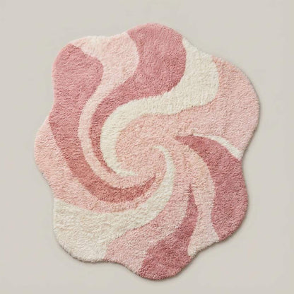 Soft blush pink and cream shag rug featuring organic curved pattern for boho modern home décor